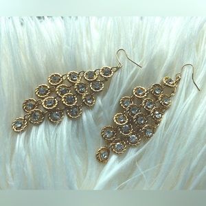 Gold dangle earrings with clear gem stones